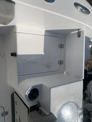 Slide: The Image of 2024 Sea Pro 262 CC boat storage compartment with sleek white finish. - 20