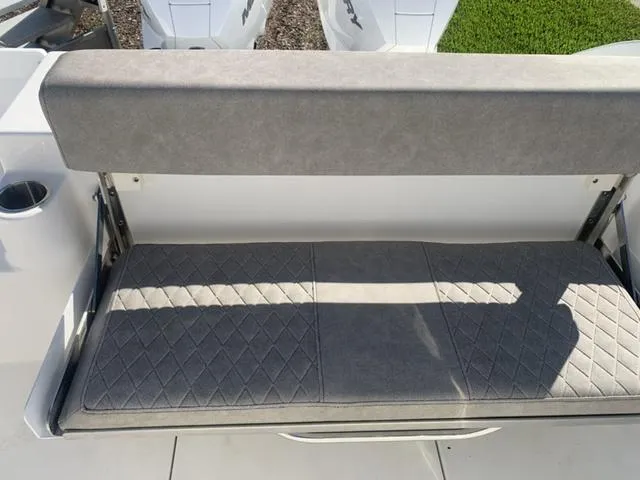Slide: The Image of 2024 Sea Pro 262 CC boat seat with gray cushioned upholstery. - 26