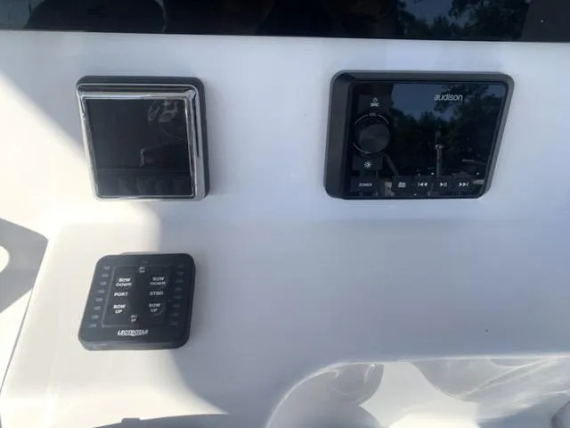 Slide: The Image of 2024 Sea Pro 262 CC dashboard with audio controls and navigation panel. - 33