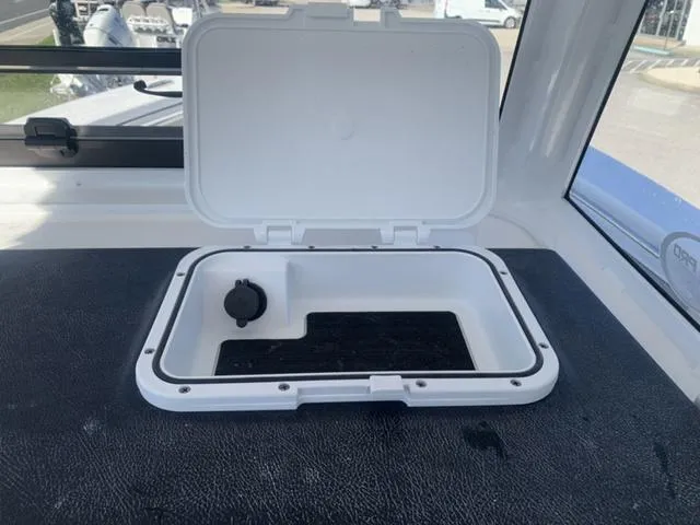 Slide: The Image of Open storage compartment on 2024 Sea Pro 262 CC boat. - 36