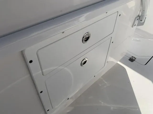 Slide: The Image of 2024 Sea Pro 262 CC storage compartment with dual access doors. - 40