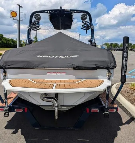 Slide: The Image of 2023 Nautique Super Air Nautique GS20 boat, rear view, covered, on trailer. - 10