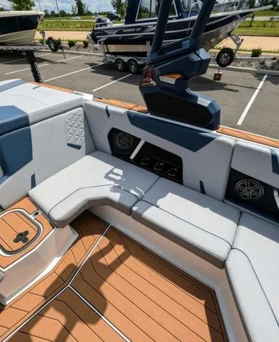 Slide: The Image of 2023 Nautique Super Air Nautique GS20 interior with premium seating and sound system. - 19