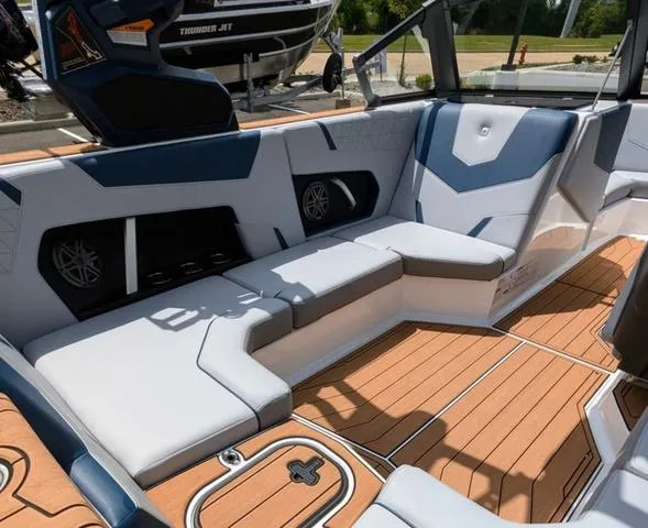 Slide: The Image of 2023 Nautique Super Air Nautique GS20 interior with white and blue seating. - 20