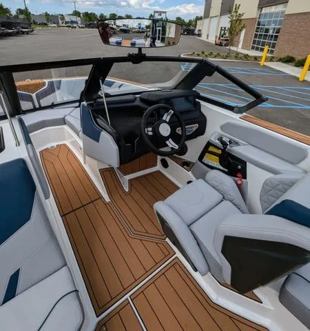 Slide: The Image of 2023 Nautique Super Air Nautique GS20 boat interior with modern dashboard and seating. - 26