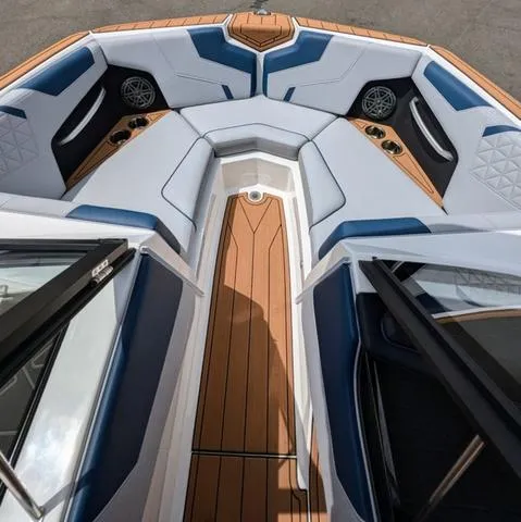 Slide: The Image of 2023 Nautique Super Air Nautique GS20 boat interior with luxurious seating and teak flooring. - 31