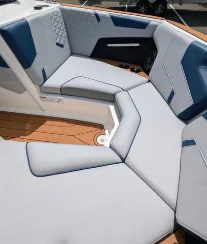 Slide: The Image of 2023 Nautique Super Air Nautique GS20 boat interior with cushioned seating. - 32