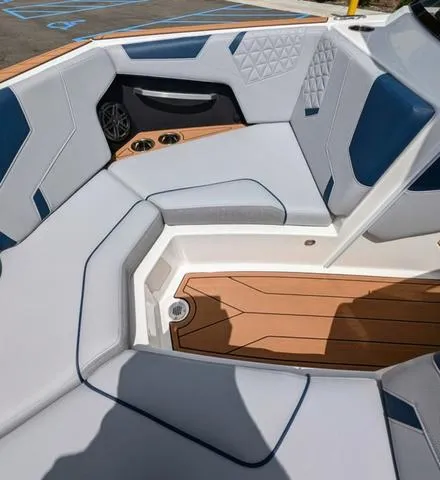 Slide: The Image of 2023 Nautique Super Air Nautique GS20 boat interior with cushioned seating and teak flooring. - 33