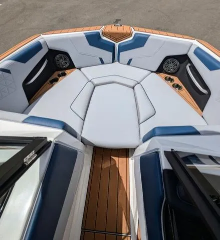 Slide: The Image of 2023 Nautique Super Air Nautique GS20 boat interior with cushioned seating and teak flooring. - 34