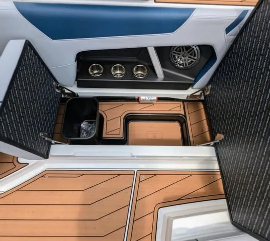 Slide: The Image of 2023 Nautique Super Air Nautique GS20 interior storage compartments and cup holders. - 37