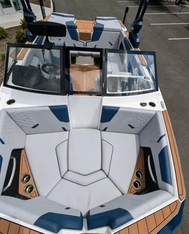 Slide: The Image of 2023 Nautique Super Air Nautique GS20 boat interior with luxurious seating and modern design. - 39