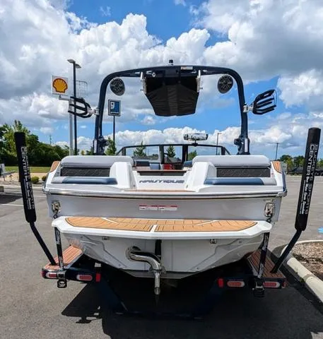 Slide: The Image of 2023 Nautique Super Air Nautique GS20 boat rear view in parking lot. - 4