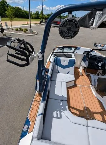 Slide: The Image of 2023 Nautique Super Air Nautique GS20 boat interior with seating and wakeboard rack. - 41