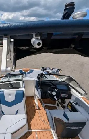 Slide: The Image of 2023 Nautique Super Air Nautique GS20 boat interior with modern dashboard and seating. - 42