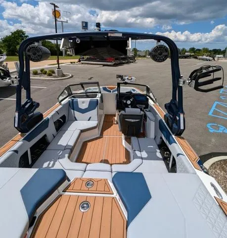 Slide: The Image of 2023 Nautique Super Air Nautique GS20 boat interior with seating and advanced audio system. - 44