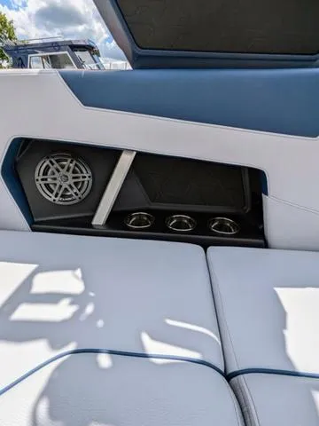 Slide: The Image of 2023 Nautique Super Air Nautique GS20 interior, featuring speaker and cup holders. - 45