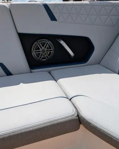 Slide: The Image of 2023 Nautique Super Air Nautique GS20 interior seating with built-in speaker. - 46