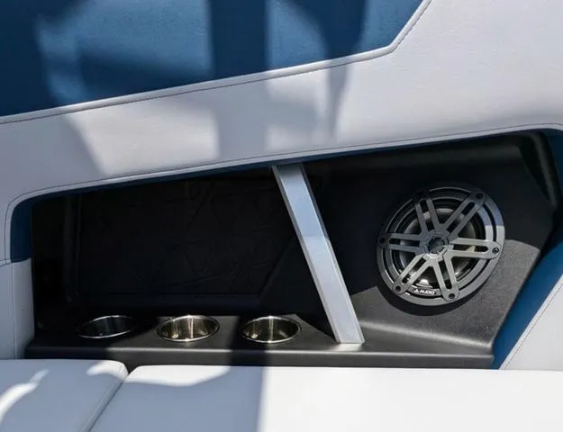 Slide: The Image of 2023 Nautique Super Air Nautique GS20 interior with cup holders and speaker. - 47