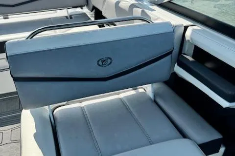 Slide: The Image of 2022 Cobalt R6 Surf boat interior with gray seating and black accents. - 24