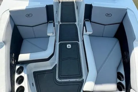 Slide: The Image of 2022 Cobalt R6 Surf boat interior with gray seating and black accents. - 30