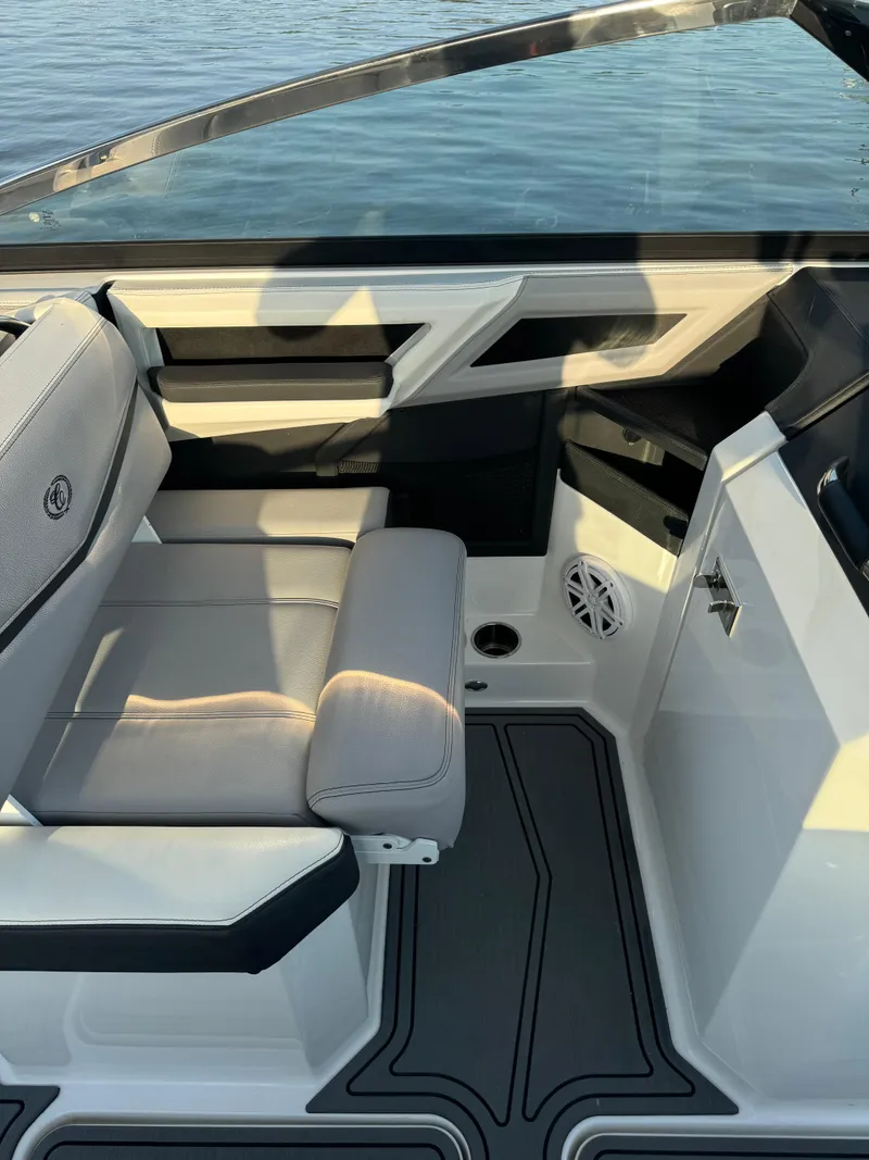 Slide: The Image of 2022 Cobalt R6 Surf boat interior with sleek seating and modern design. - 32