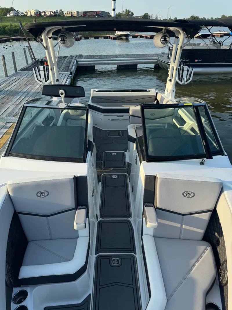 Slide: The Image of 2022 Cobalt R6 Surf boat interior at dock, featuring sleek seating and modern design. - 36