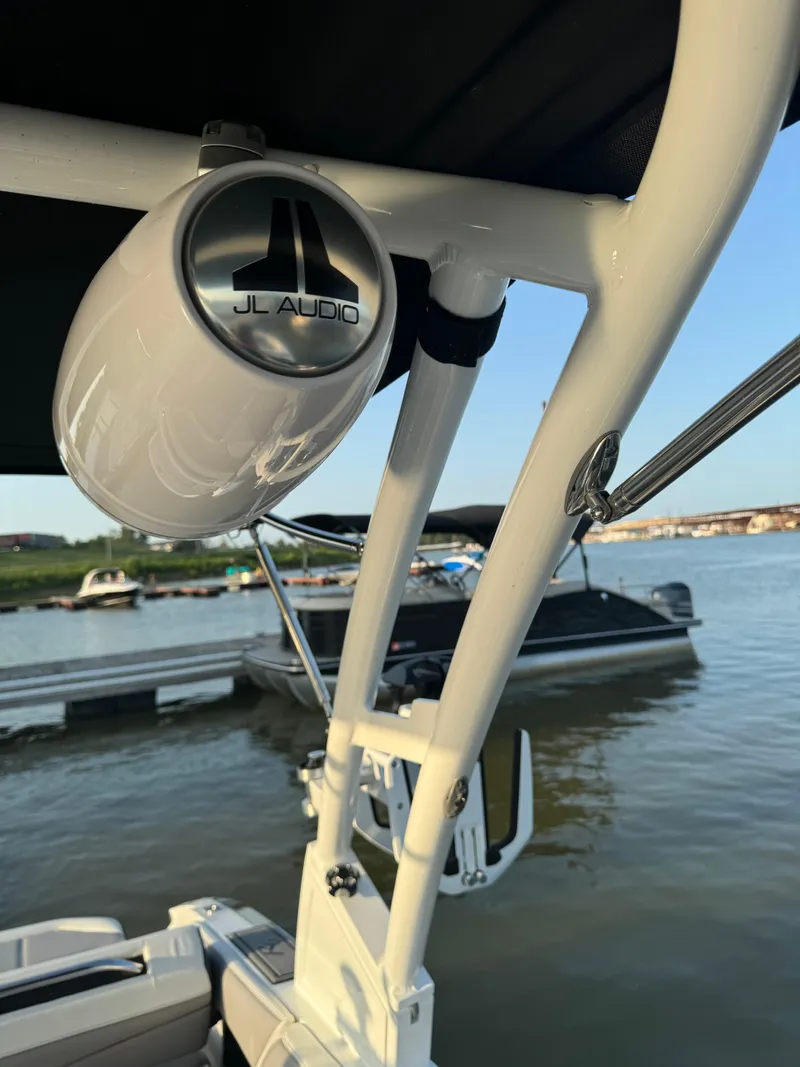 Slide: The Image of 2022 Cobalt R6 Surf boat with JL Audio speaker by a lake. - 44