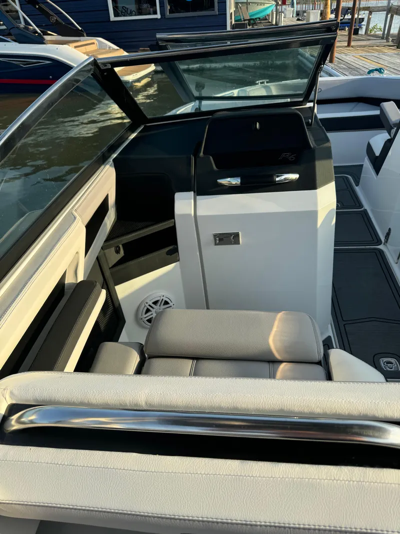 Slide: The Image of 2022 Cobalt R6 Surf boat interior with modern seating and sleek design. - 49