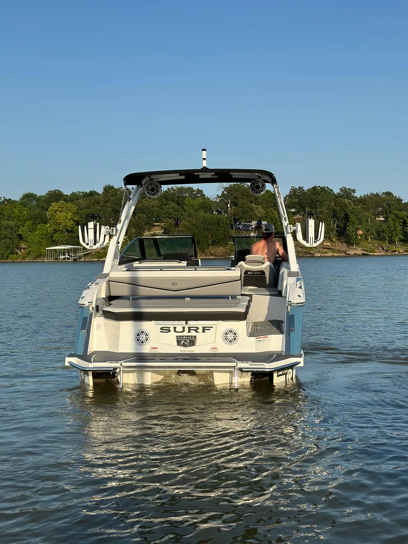 Slide: The Image of 2022 Cobalt R6 Surf boat on a calm lake, sunny day. - 6