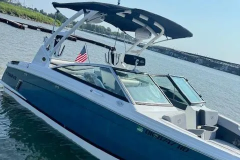 Slide: The Image of 2022 Cobalt R6 Surf boat docked on a sunny day. - 8