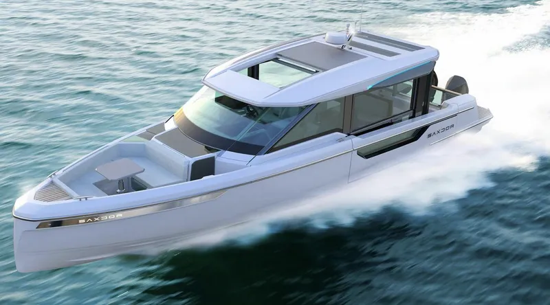 Slide: The Image of 2025 Saxdor 400 GTC luxury motorboat cruising on open water. - 2