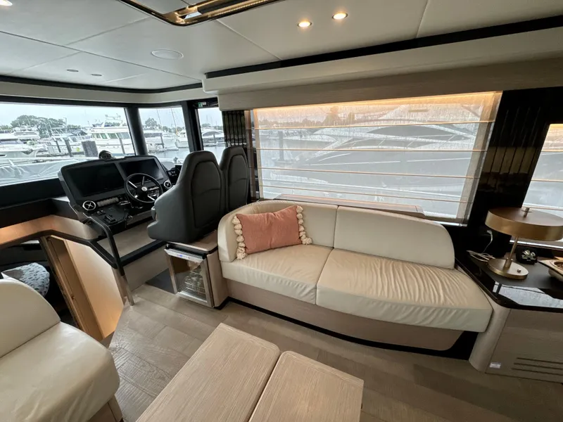 Slide: The Image of Luxurious interior of 2023 Absolute 52 Navetta yacht with modern seating and helm. - 10