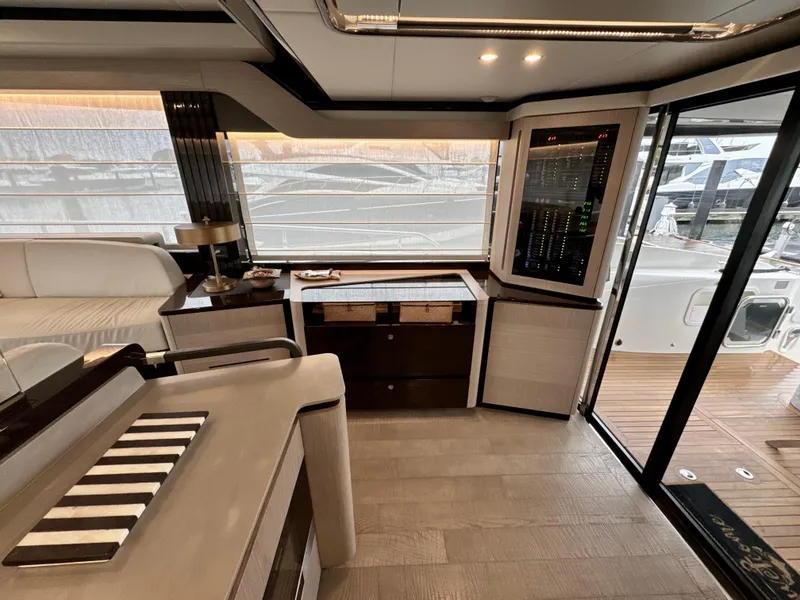 Slide: The Image of Luxurious interior of 2023 Absolute 52 Navetta yacht with modern design and elegant furnishings. - 11