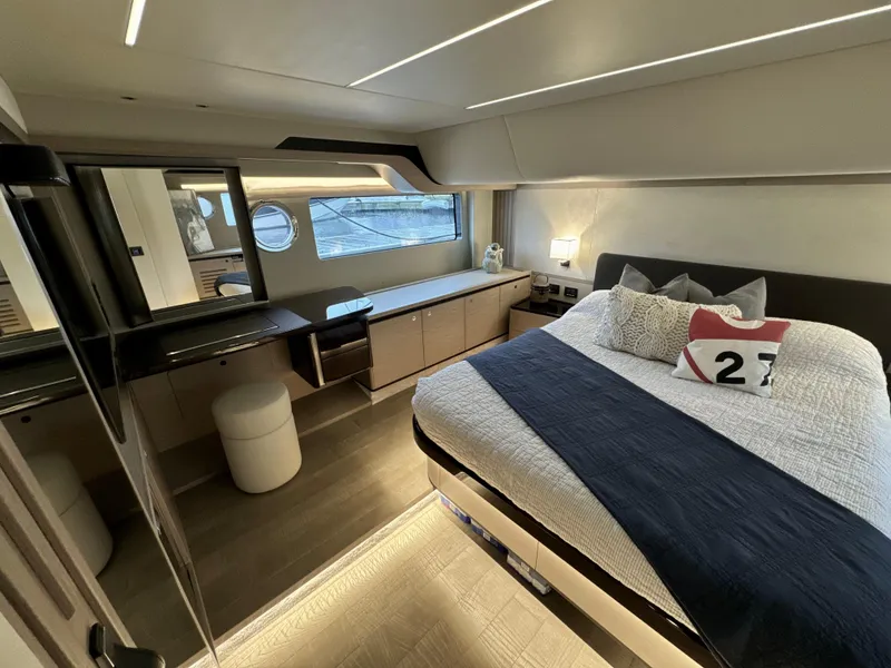 Slide: The Image of Luxurious 2023 Absolute 52 Navetta yacht bedroom with modern decor and elegant furnishings. - 14