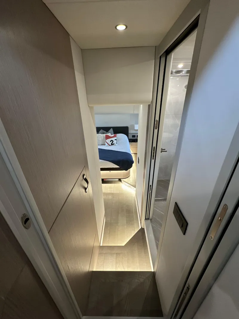 Slide: The Image of Interior hallway of 2023 Absolute 52 Navetta yacht leading to a bedroom. - 18