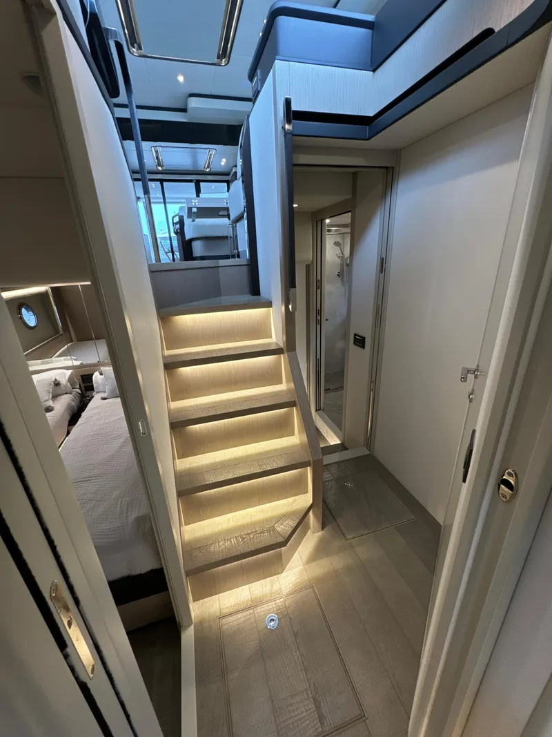 Slide: The Image of Luxurious interior of 2023 Absolute 52 Navetta yacht with illuminated stairs and modern design. - 21
