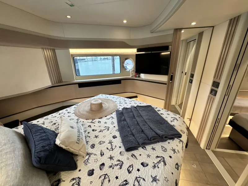 Slide: The Image of Luxurious bedroom interior of 2023 Absolute 52 Navetta yacht with nautical decor. - 22