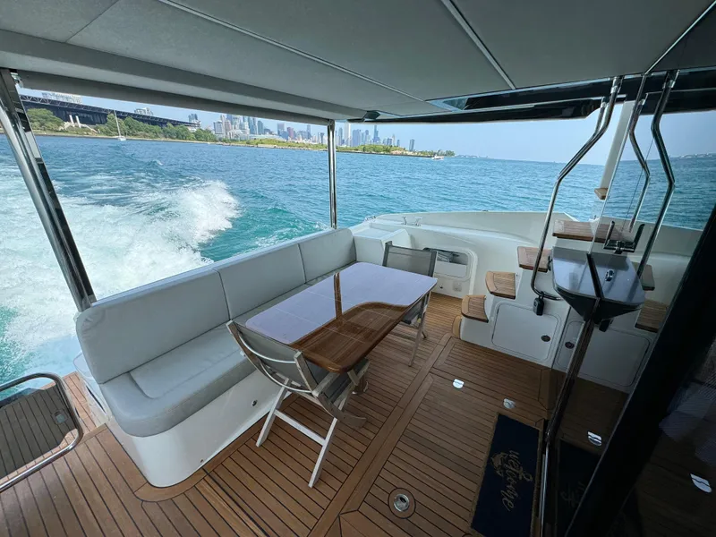 Slide: The Image of Luxurious 2023 Absolute 52 Navetta yacht interior with scenic ocean view. - 27