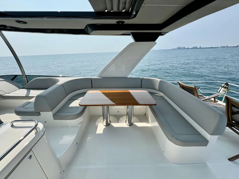Slide: The Image of Luxurious seating area on 2023 Absolute 52 Navetta yacht with ocean view. - 30