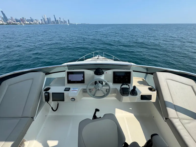Slide: The Image of Cockpit view of 2023 Absolute 52 Navetta yacht on open water. - 35
