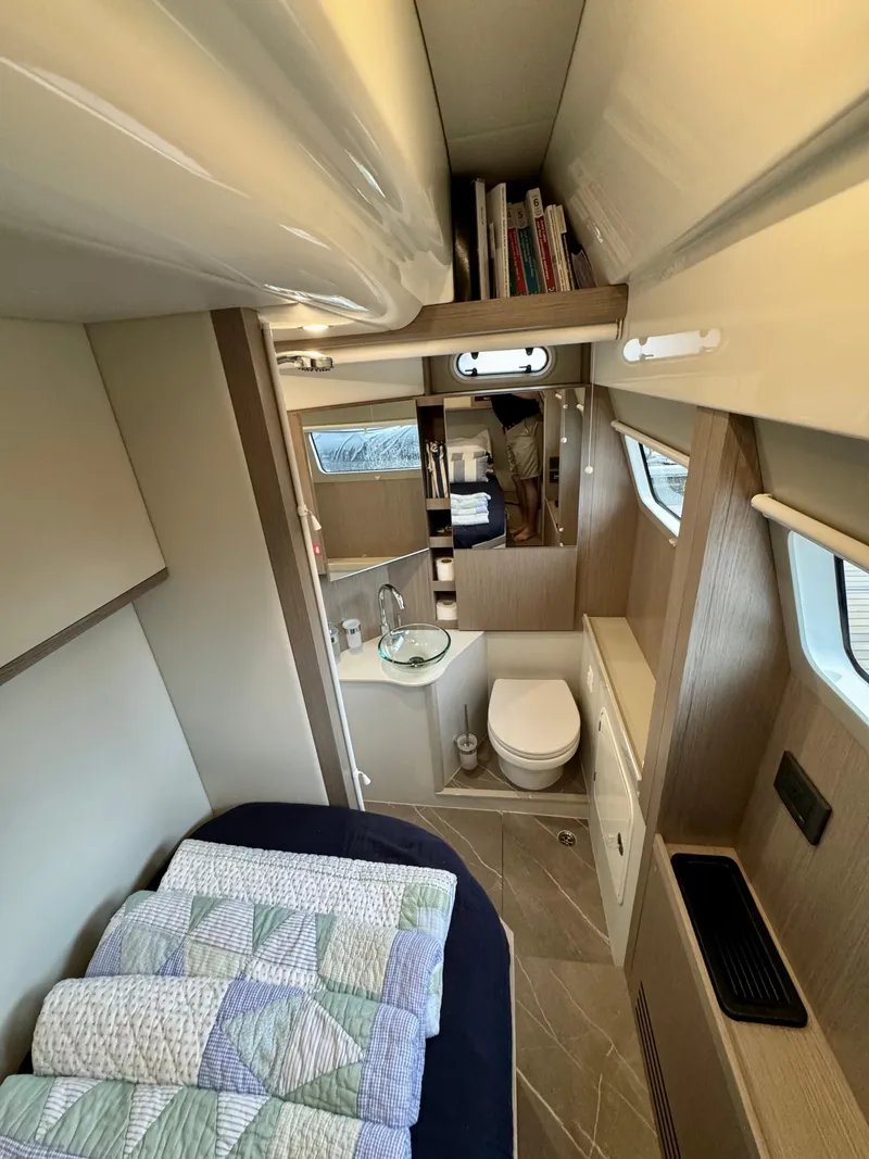 Slide: The Image of Interior of 2023 Absolute 52 Navetta yacht with bed, bathroom, and modern design. - 37