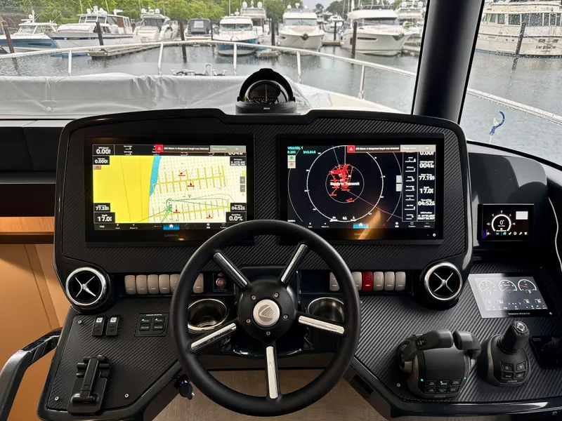 Slide: The Image of Cockpit of 2023 Absolute 52 Navetta yacht with advanced navigation displays. - 5