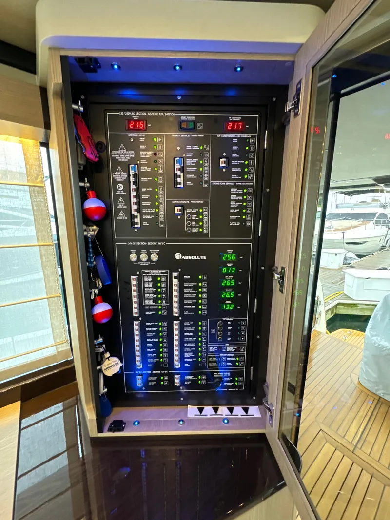 Slide: The Image of Electrical control panel on 2023 Absolute 52 Navetta yacht, showcasing advanced systems. - 7