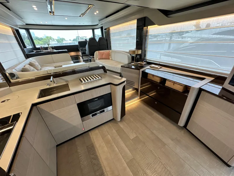 Slide: The Image of Luxurious interior of 2023 Absolute 52 Navetta yacht with modern kitchen and seating area. - 9