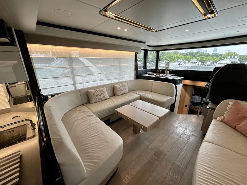 Slide: The Image of Luxurious interior of 2023 Absolute 52 Navetta yacht with elegant seating and modern design. - 12