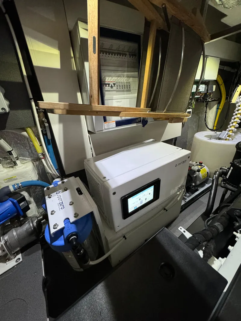 Slide: The Image of Engine room of 2023 Absolute 52 Navetta yacht with advanced equipment and control systems. - 38