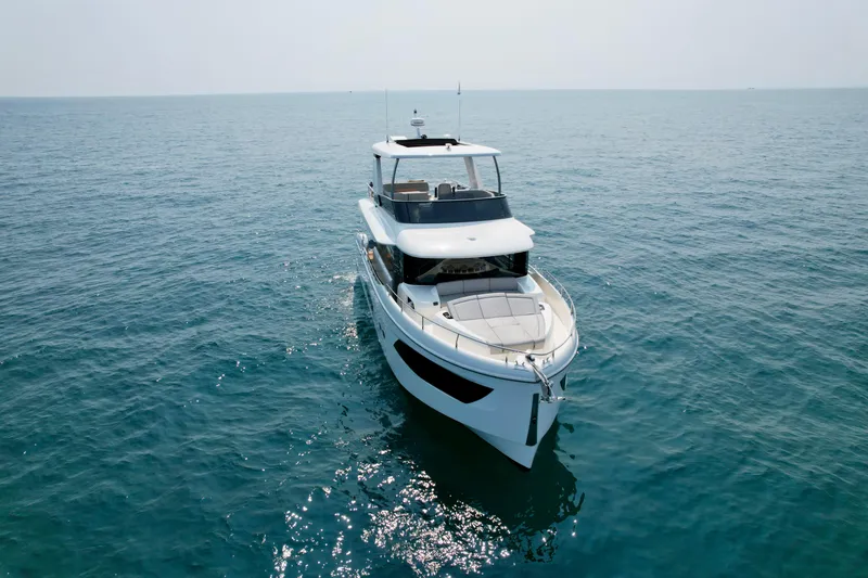 Slide: The Image of 2023 Absolute 52 Navetta yacht cruising on open sea. - 4
