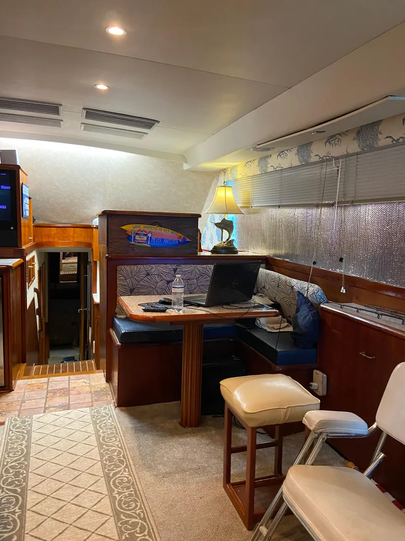 Slide: The Image of Interior of 1988 Ocean Yachts 55 Super Sport with cozy seating and elegant decor. - 12