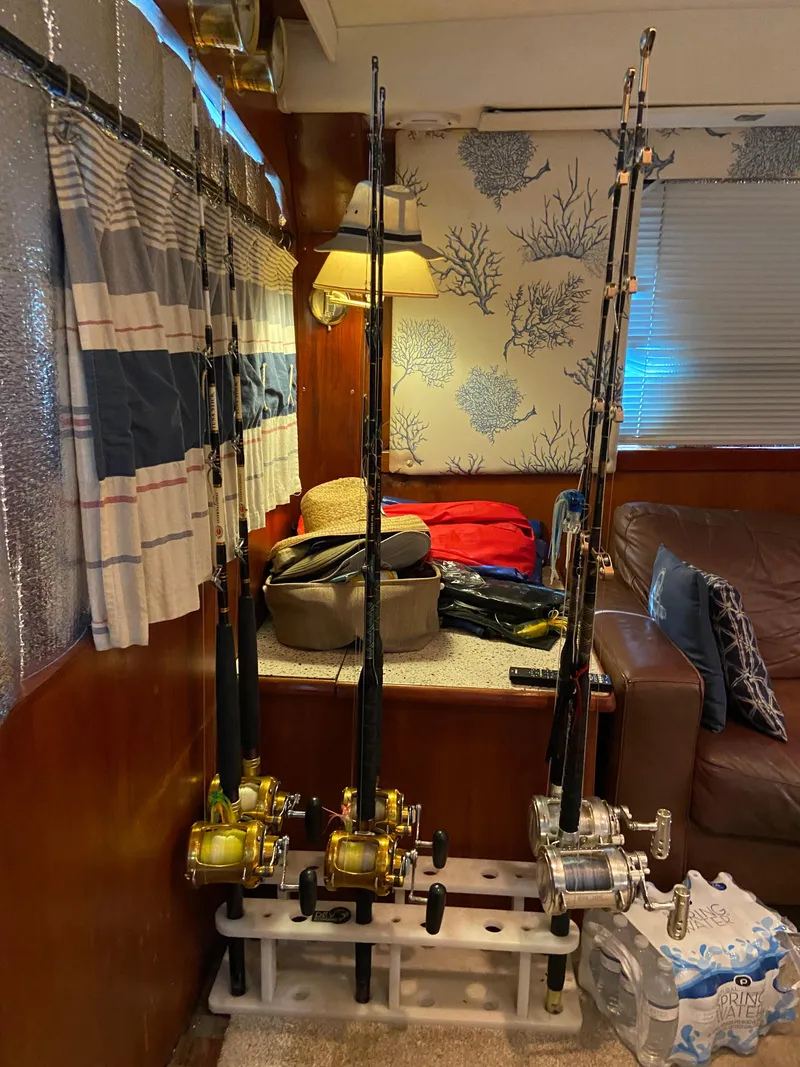 Slide: The Image of Fishing rods inside 1988 Ocean Yachts 55 Super Sport, cozy cabin interior. - 17