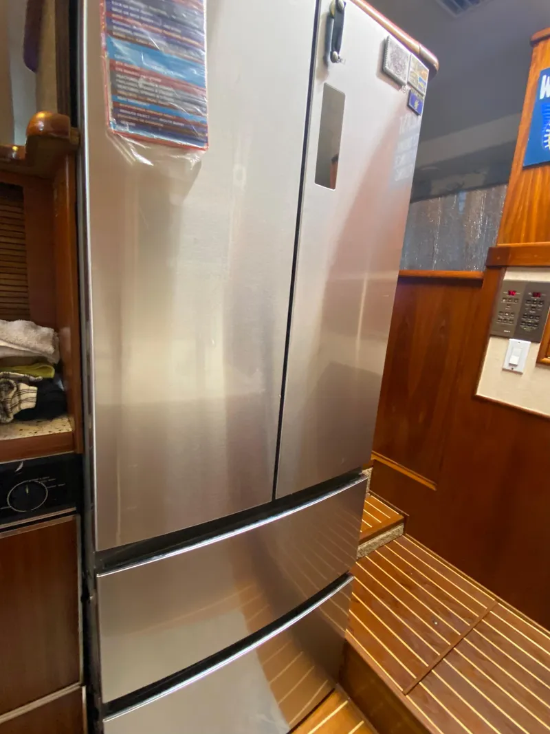 Slide: The Image of Stainless steel refrigerator in 1988 Ocean Yachts 55 Super Sport interior. - 21